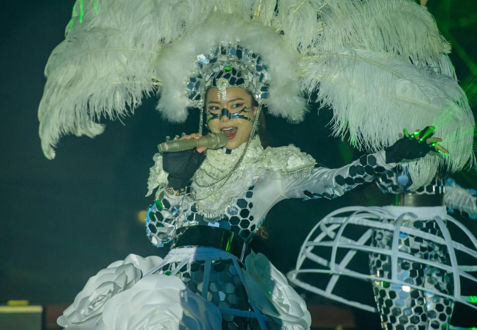 Tincy Tan performing in an elaborate mirrored costume
