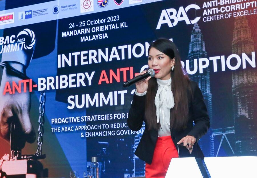 Tincy Tan hosting a conference